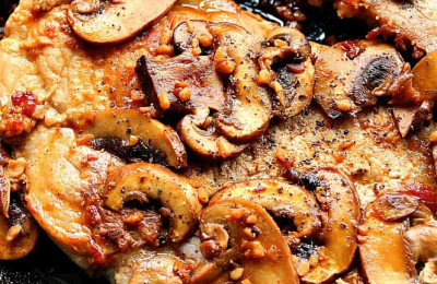 Sautéed Pork and Mushrooms in a Skillet
